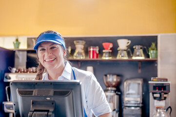 Latina girl smiles at the camera, showing kindness to the client.