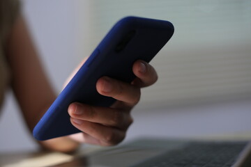 Successful Asian businesswoman sitting at desk working using laptop computer in office. Business and people concept. Businesswoman using laptop computer and working with documents.