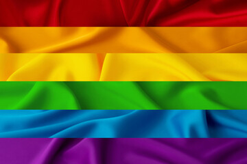 Waving rainbow flag, LGBT community sign. Rainbow flag with fabric texture. LGBT colors background