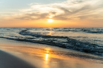 Fototapeta premium Scenic view of sunset over a calm ocean