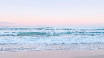 Obraz premium Serene Waves Gently Rolling Onto Sandy Beach at Sunset in Tranquil Coastal Landscape
