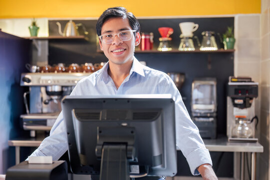 Portrait of a young Latino who works in a coffee shop as general manager.