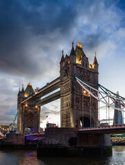 Historic Bridge over River Thames and Cityscape Skyline during dramatic sunset. Tower Bridge in City of London, United Kingdom. Travel Destination