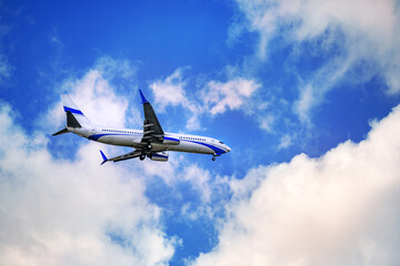 An airplane is flying in the sky