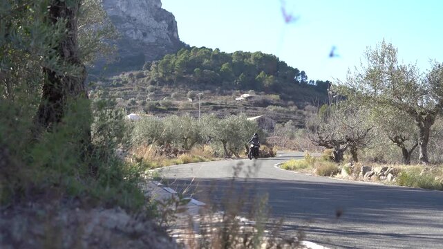 Motorcycle rider on a mountain road