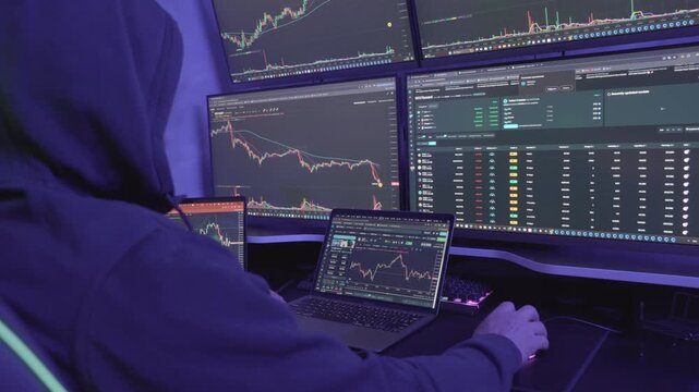 Hooded male hacker scams and steals cryptocurrency