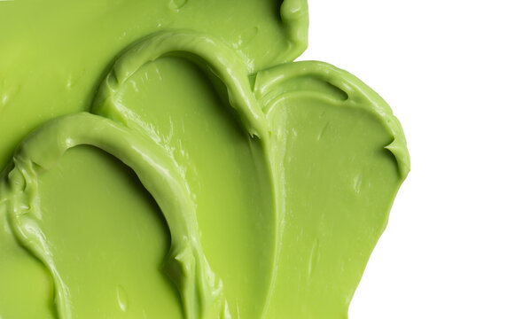 Swatch texture of green cream cray kaolin cosmetic mask for face and body on a white isolated background. Copy space