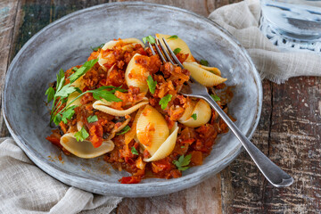 Pasta shells with tomato, mushrooms and chorizo sauce