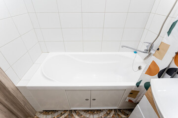 This elegantly designed bathroom features a relaxing bathtub, a convenient sink, and a stylish shower curtain, merging aesthetics with functionality for a cozy experience