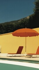 Fototapeta premium Loungers bask under the warm sun beside a turquoise pool oasis