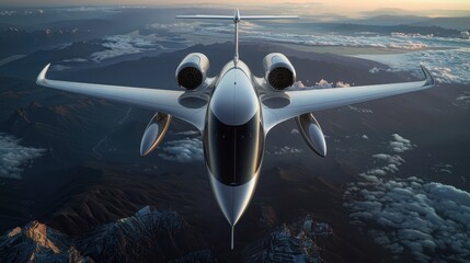 Private jet flying high above the clouds with mountains below during what appears to be either sunrise or sunset