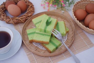 pandan cake on a wooden plate. Selective focus.