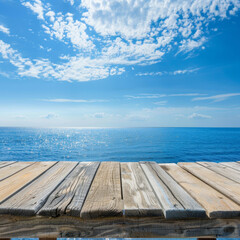 Fototapeta premium Wooden Plank Overlooking the Sparkling Blue Ocean and a Cloudy Sky