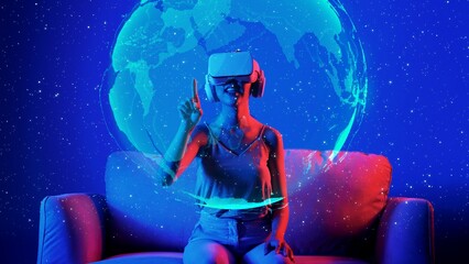 Siting on sofa woman using VR turning rotate surface earth metaverse pointing bright lighting neon digital universe virtual space fantastic exploration nebula 3D meta global hologram. Hallucination.