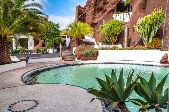 Nazaret, Lanzarote, Canary Islands, Spain - March 19, 2023: Lagomar museum or Casa Omar Sharif with cactus garden and pools, built into rock caves by Cesar Manrique