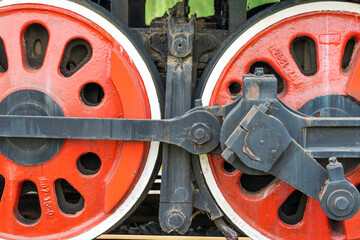 The wheels of an old steam locomotive