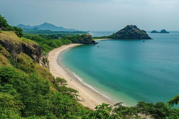 view from the top of a rocky beach, the sea is calm and flat with some small waves