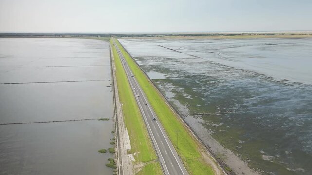Drone flight over the road to Romo Island in Denmark 