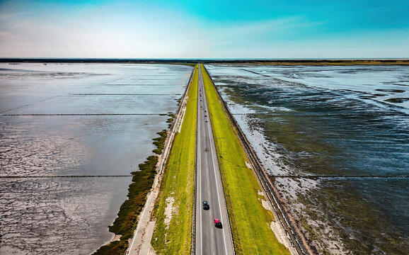 Drone flight over the road to Romo Island in Denmark 