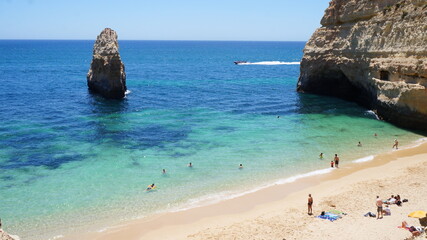 Beach with Crystal Clear Waters and Rock Formations