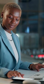 Typing, keyboard and black woman in office at night working on client investment risk report. Computer, reading and African female actuary with deadline for stock market trading metrics in workplace