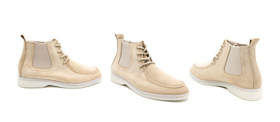 Pair of fashionable suede leather boots isolated on white background. View from all sides.