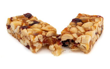 Bar with peanuts, hazelnuts, caramel and chocolate on a white background. View from above. Nut bar isolate. Sugar