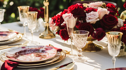Fototapeta premium Wedding and event celebration tablescape with flowers, formal dinner table setting with roses and wine, elegant floral table decor for dinner party and holiday decoration, home styling idea