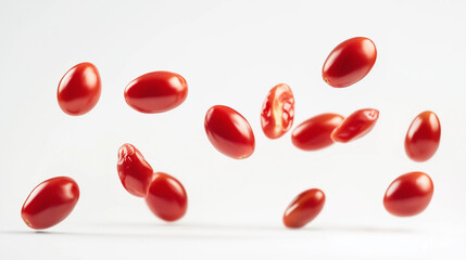 Falling cherry tomatoes isolated on white background 