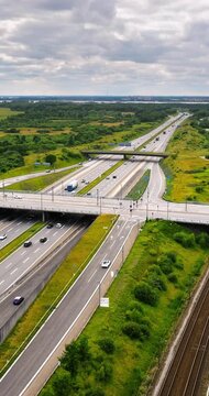 Aerial drone view of the European route E20 on a cloudy day. Vertical