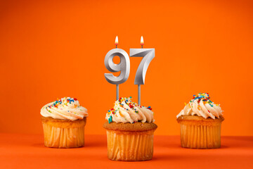 Birthday celebration in orange color - Candle number 97