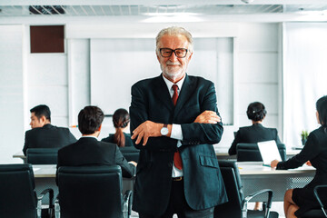 Senior executive CEO manager standing in front of team members Business leadership concept. uds