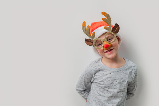 Young child dressed as a reindeer for Christmas celebration
