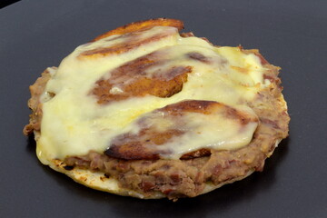 Arepa with cheese and fried sweet ripe plantains.