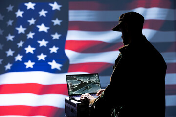 US Air Force dispatcher looking at surveillance transmission on device, relaying data to ground...