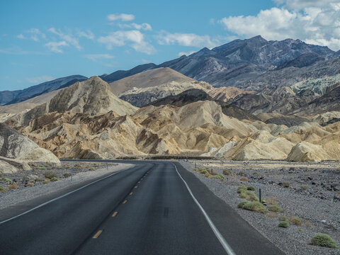Lonely road through rock landscape, Artists Drive, Highway 190, Death Valley National Park, California, USA, North America
