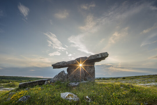 The Poulnabrone Dolmen with Sun Star, Pre-Historic Stone-chamber Grave or Portal Tomb, Burren, County Clare, Republic of Ireland