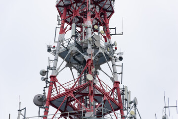white and red mast with radio antennas