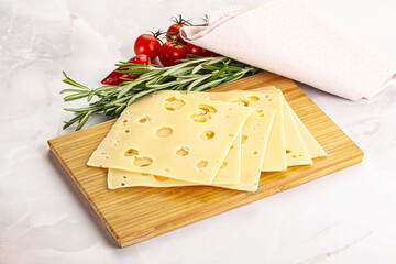 Sliced maasdam cheese with holes