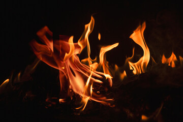 Abstract blaze fire flame texture for banner background. Fire flames on black background. Fire...