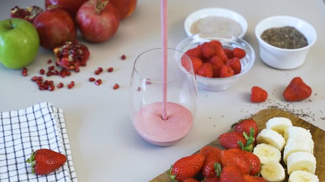 SMOOTHIE FRUITS filling a glass in SLOW MOTION