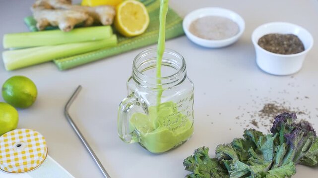SMOOTHIE from VEGETABLES falling into a glass mug in SLOW MOTION