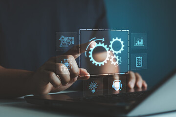 Robotic process automation concept, RPA, artificial intelligence. Man use laptop with virtual automation technology to automate business tasks with AI. Digital transformation and change management.