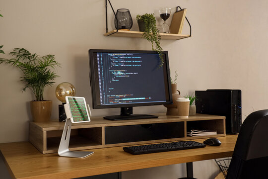 Modern workplace of programmer with computer in office