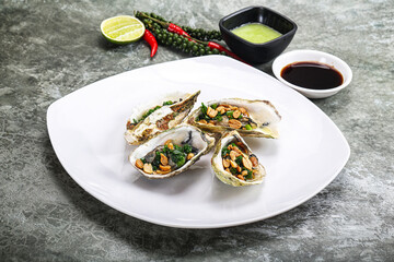 Open half oysters with green onion