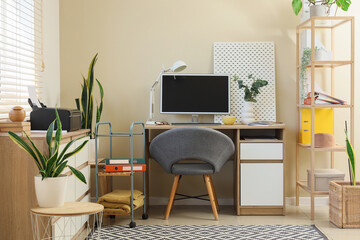 Interior of office with workplace and printer on commode