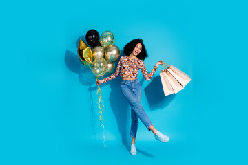 Photo of cheerful glad cute woman wear trendy clothes hold balloon store mall sale empty space...