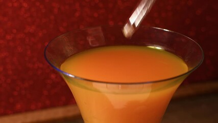 Close-up alcoholic drink being spiked with a drug using an eye dropper mockup nightclub setting copy space