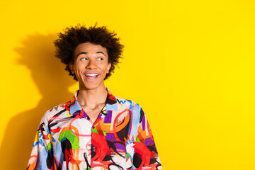 Photo of nice young man look empty space wear shirt isolated on bright yellow color background