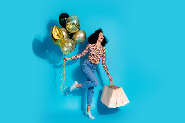 Photo of cheerful funny lovely woman wear trendy clothes hold balloon sale empty space isolated on...